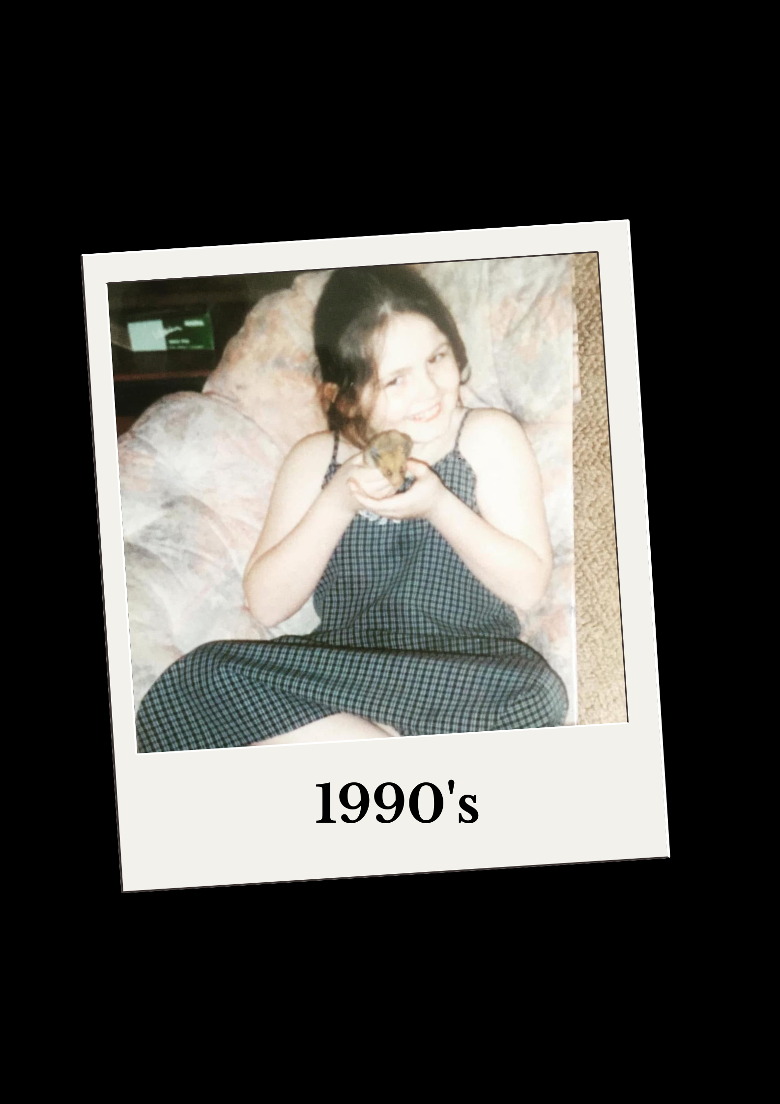 Lisa aged around 8 sitting with a little hamster