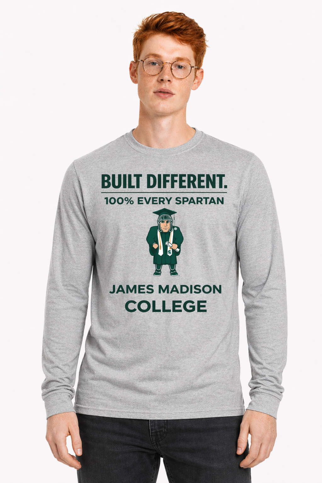 Model wearing a gray James Madison College T-shirt with “Built Different” text on a white background