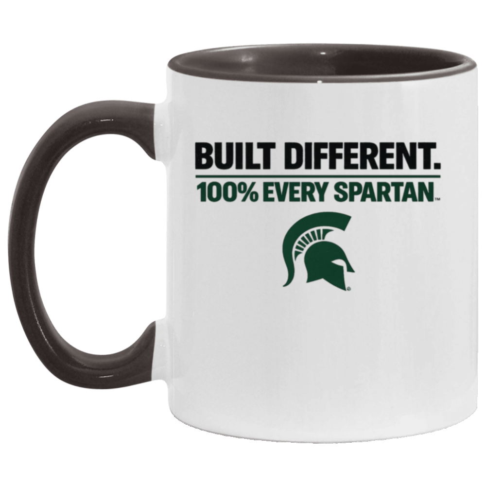White mug with black handle and rim, reading “BUILT DIFFERENT. 100% EVERY SPARTAN.” with green Spartan helmet logo.