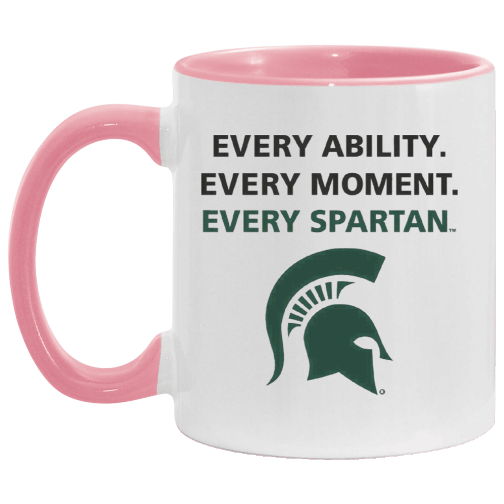 White mug with pink handle and rim, reading “Every ability. Every moment. Every Spartan.” with a green Spartan helmet logo.