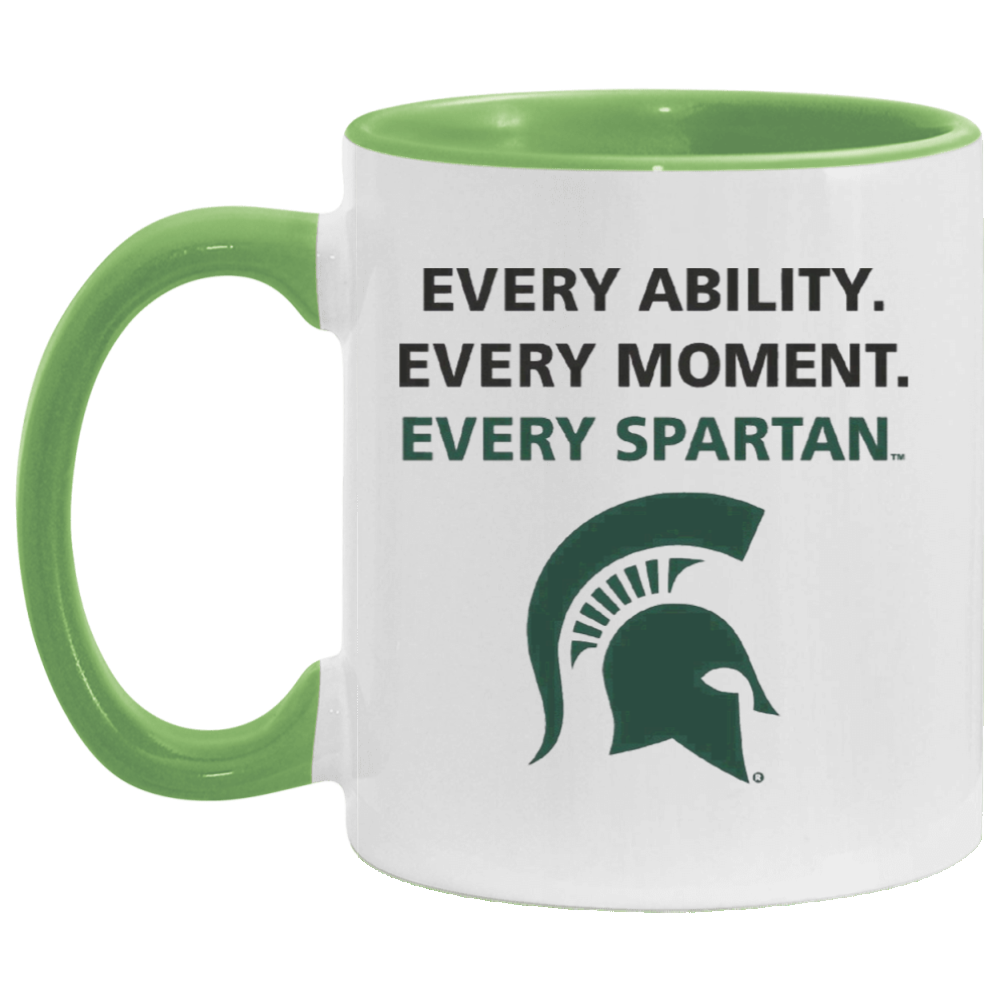 White mug with green handle and rim, featuring a Spartan helmet logo and text “Every ability. Every moment. Every Spartan.”