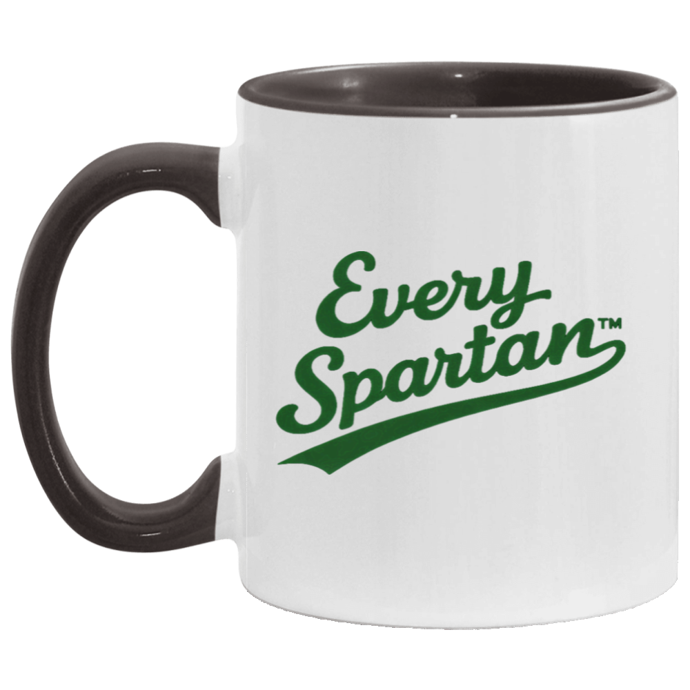 White mug with dark handle and rim, featuring green 