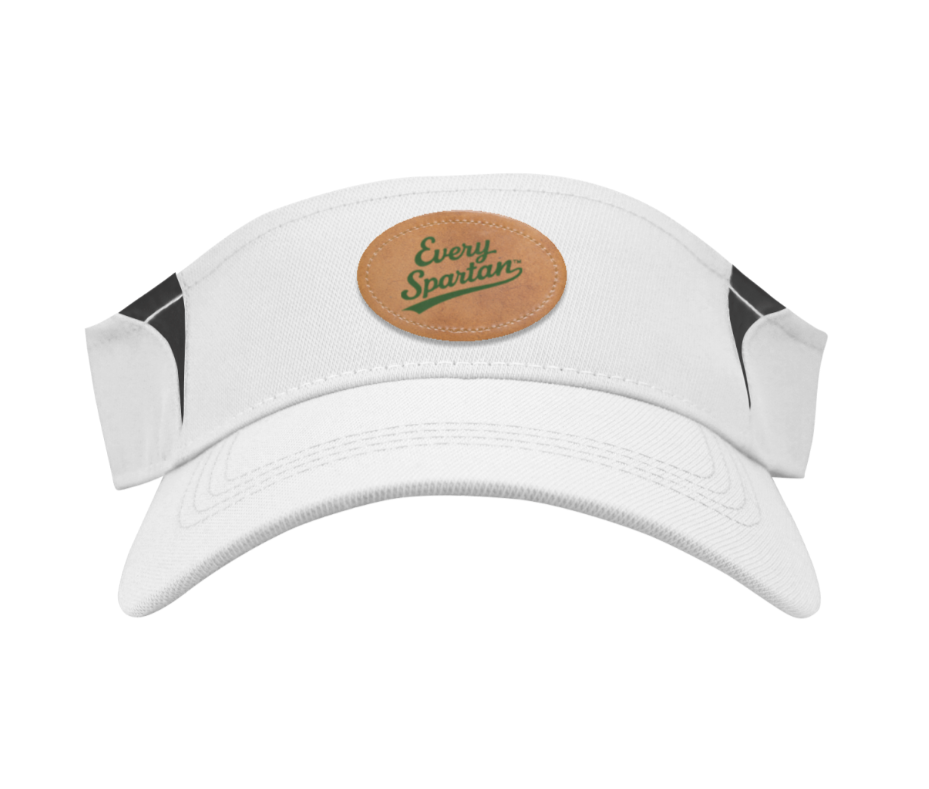 White visor hat with tan circular 