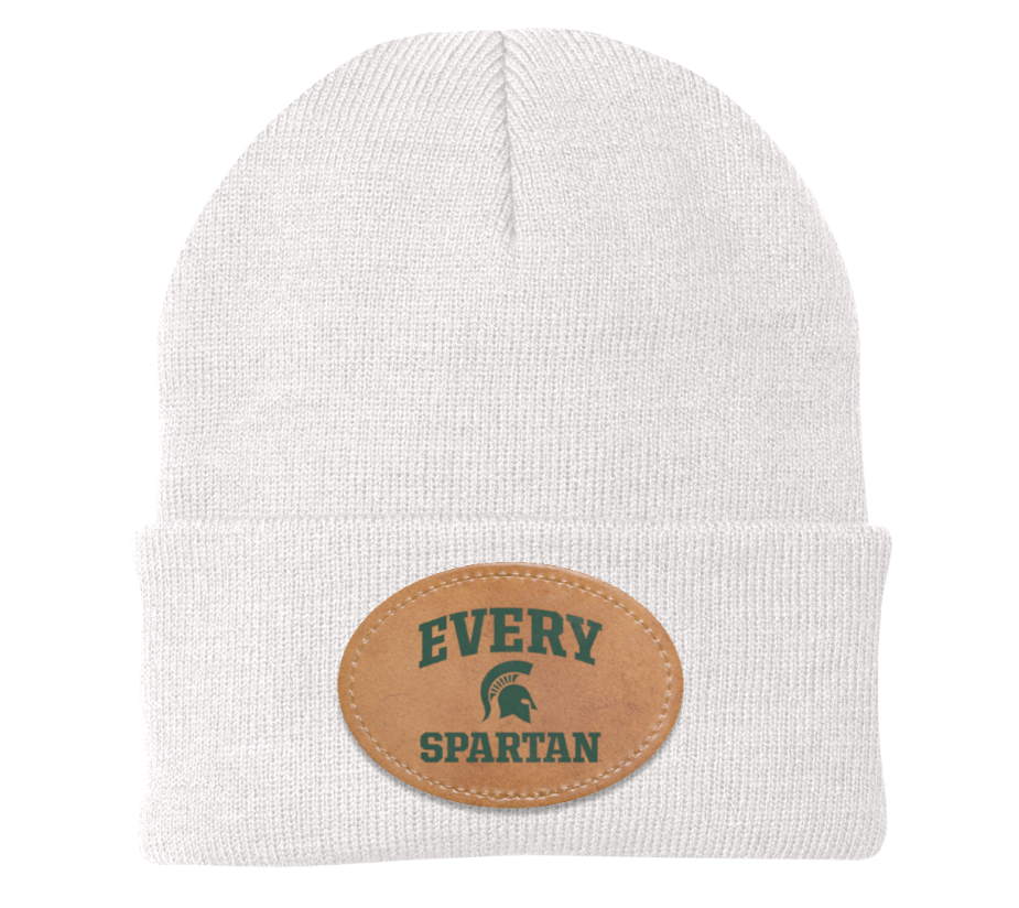 White knit beanie with a tan oval patch reading “EVERY SPARTAN”