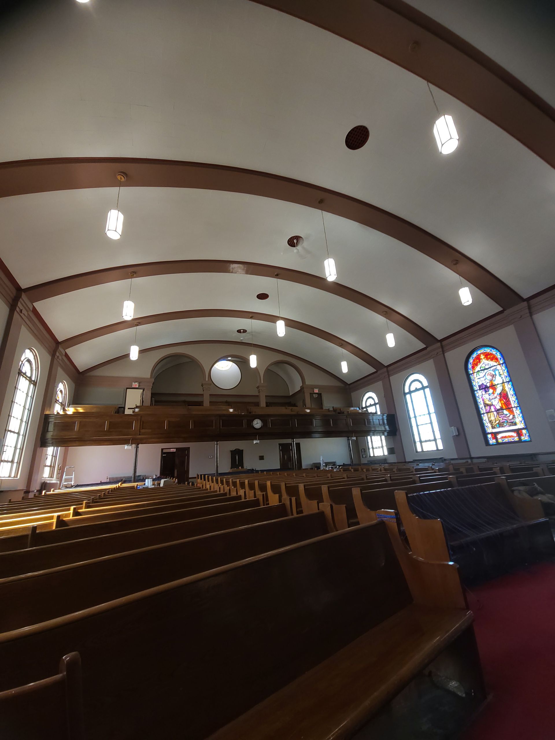 The inside of a church with stained glass windows