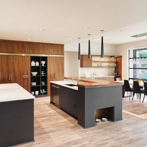 A kitchen with a large island in the middle