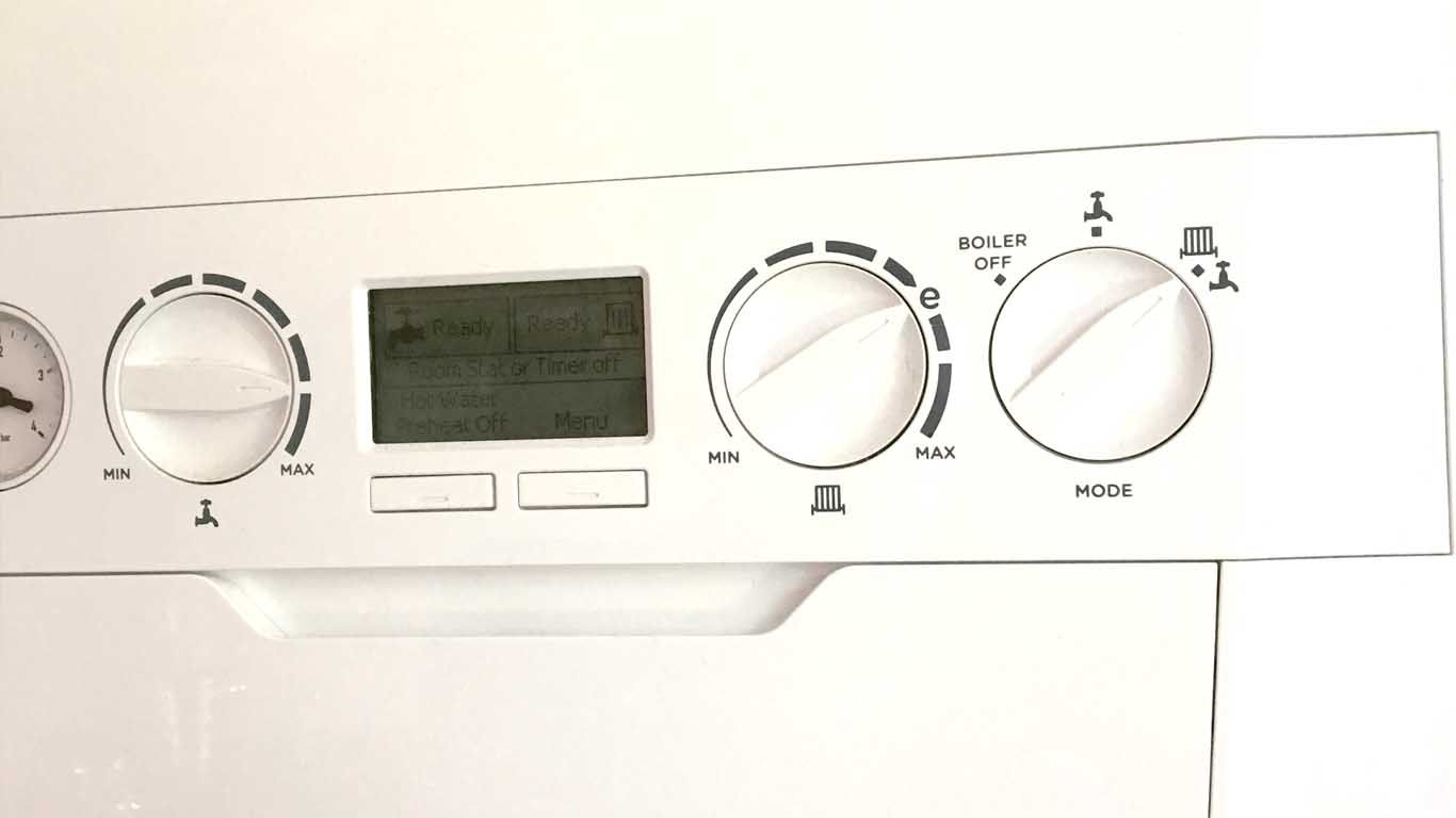 A white appliance with a clock and buttons on it