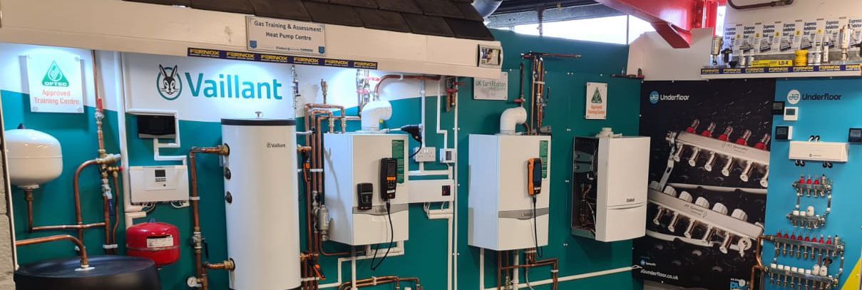 A room filled with lots of appliances and a sign that says vaillant.