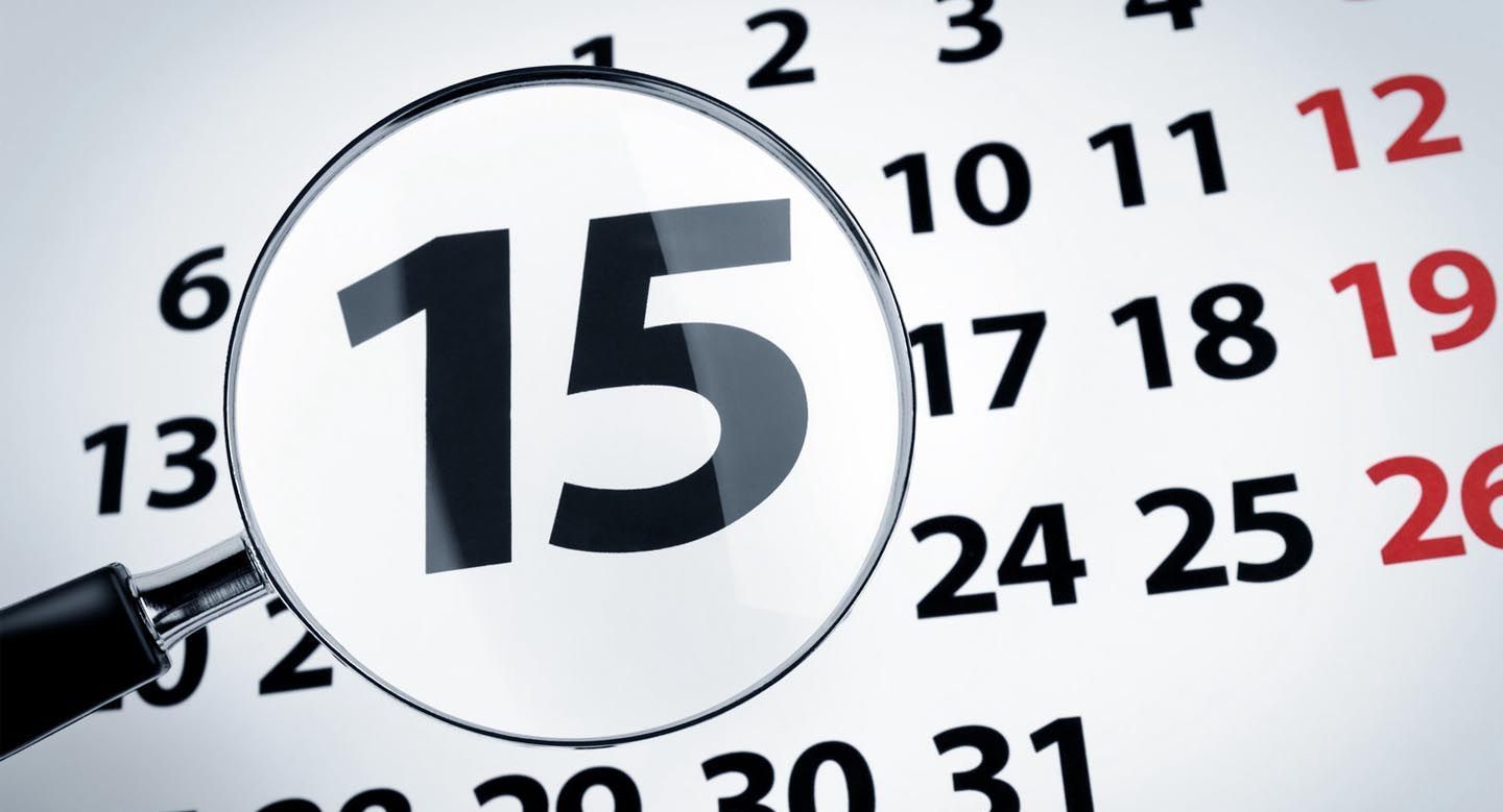 A magnifying glass is looking at the number 15 on a calendar