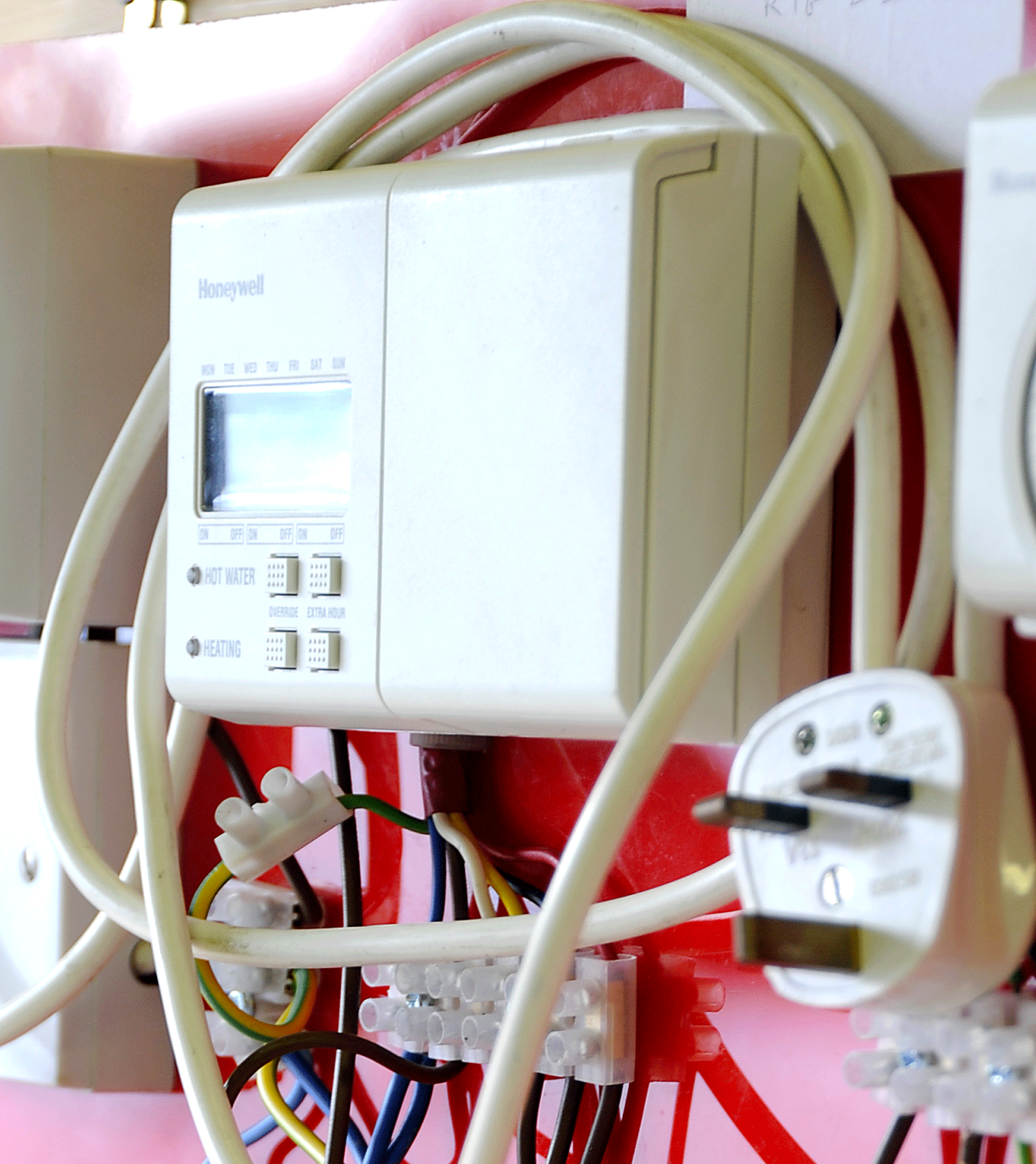 A bunch of wires are connected to a device that says ' panasonic ' on it
