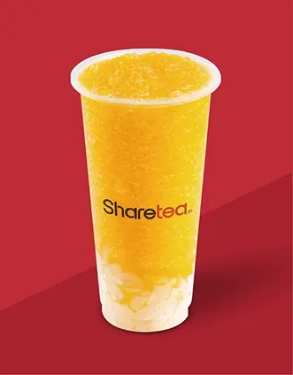 Tall yellow Sharetea drink with icy fruit texture on a red background