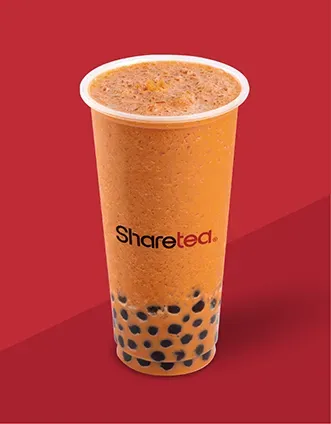 Tall bubble tea cup with orange drink, black tapioca pearls, and Sharetea logo on a red background