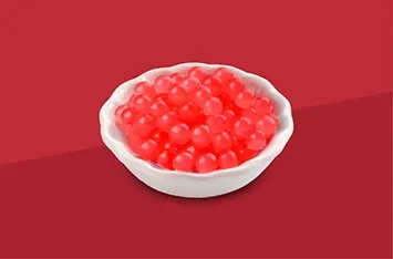 White bowl filled with glossy red berries on a red background