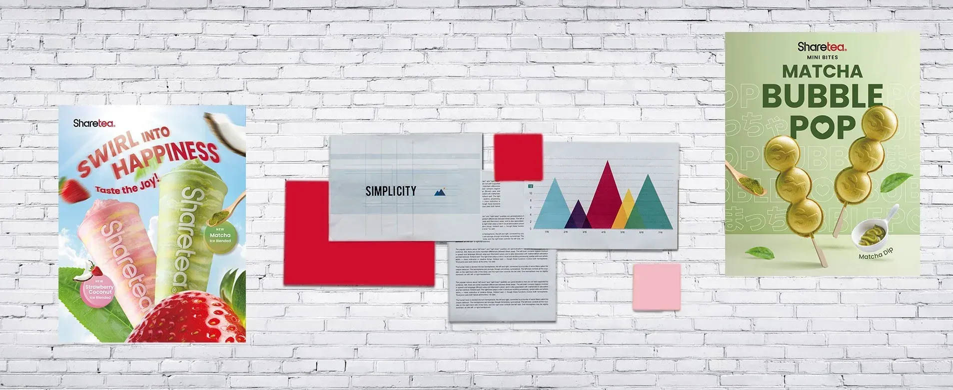 Colorful educational bubble pop posters and charts displayed on a white brick wall.