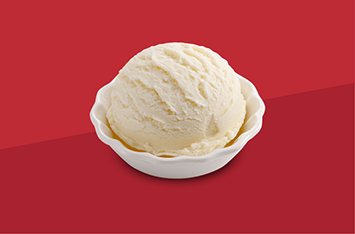 A scoop of vanilla ice cream in a white bowl on a red background