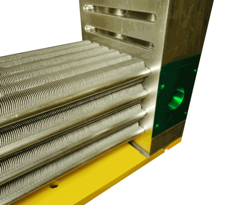 A close-up of a metallic finned tube assembly attached to a machined block, set against a yellow base.