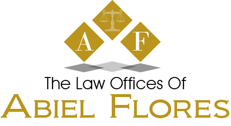 Logo for The Law Offices of Abiel Flores with gold diamond emblems and black-and-gold text