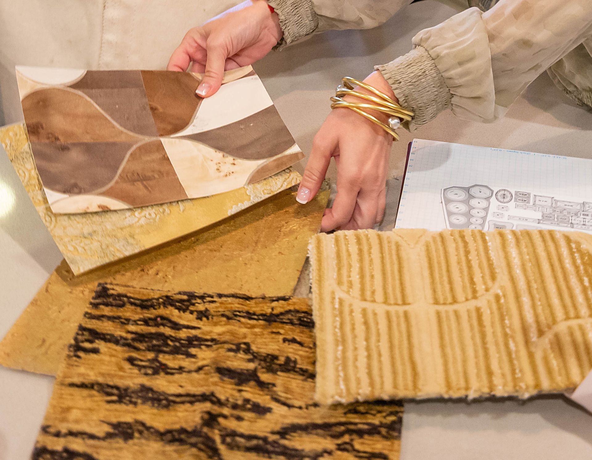 Carrie Riddle Interior Design is holding a piece of paper with a pattern on it