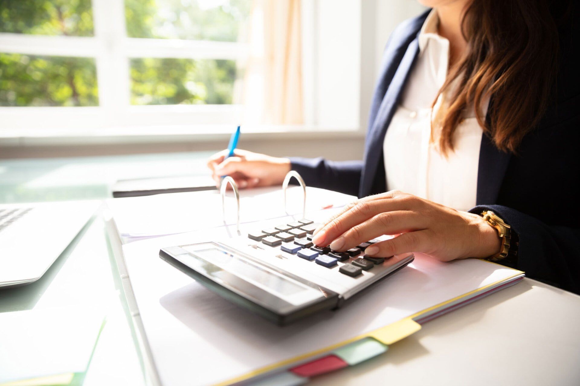 Businesswoman Calculating Invoice — Wilmington, NC — Accounting By Jerry