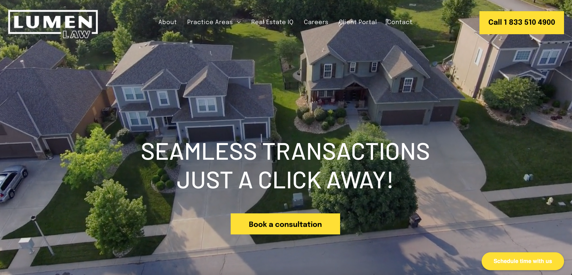 Aerial view of suburban homes with a real estate website banner reading “Seamless transactions just a click away!”