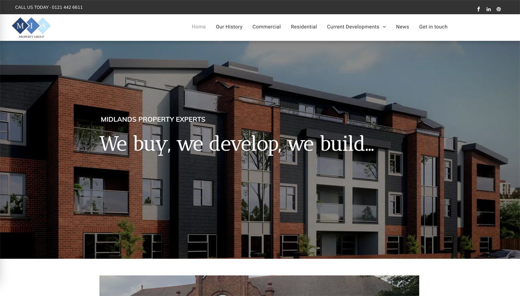 Website homepage hero showing modern brick apartment buildings with the text “We buy, we develop, we build.”