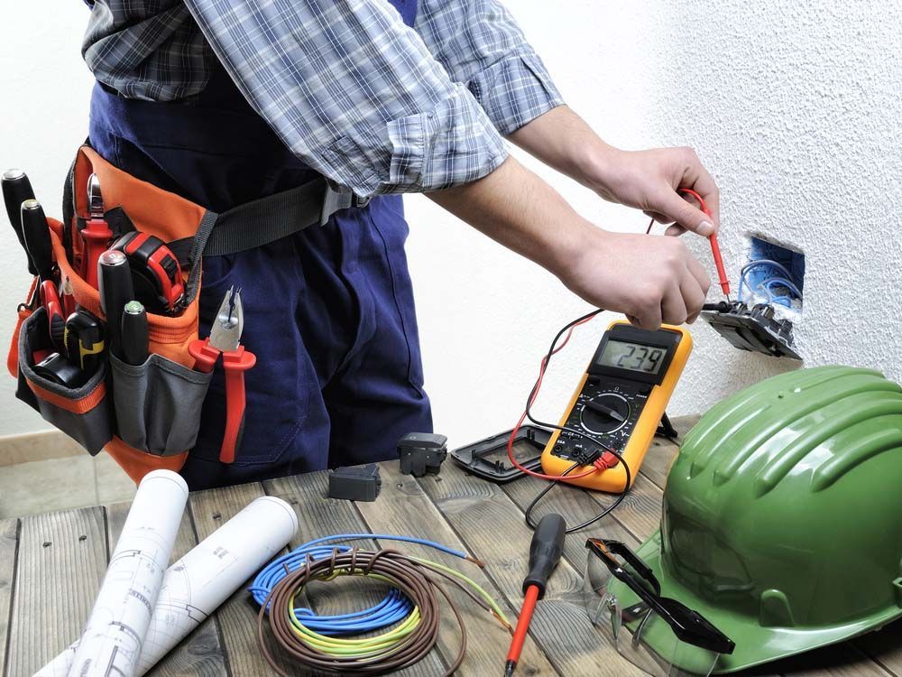 Electrician Working on Electrical Outlet - Residential Electrician in Tamworth, NSW