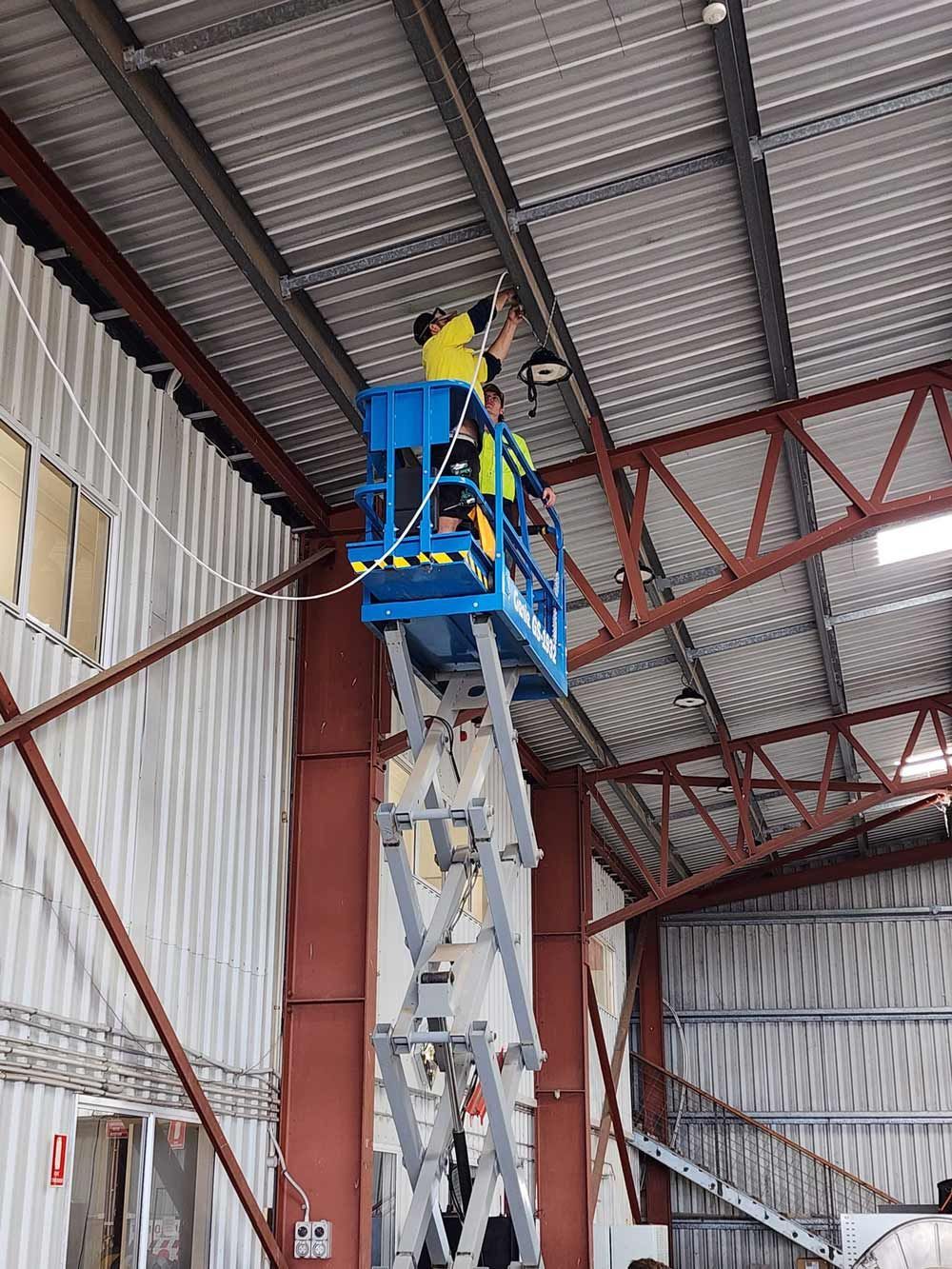 A Commercial Electrician At Work