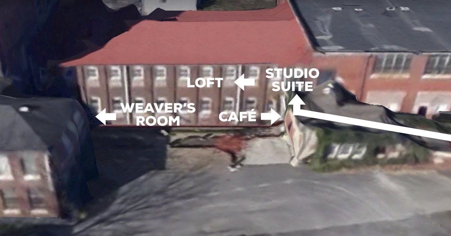 An aerial view of a building with arrows pointing to the loft suite and weaver 's room