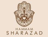 Logo di Hammam Sharazad con un elaborato disegno di Hamsa marrone su sfondo beige.