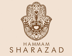Logo di Hammam Sharazad con un elaborato disegno di Hamsa marrone su sfondo beige.