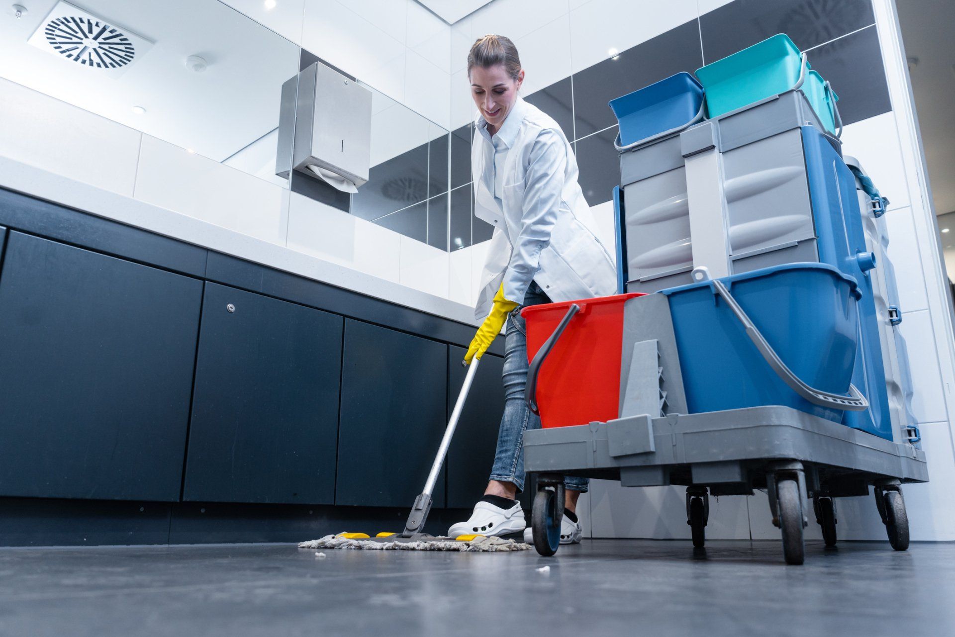 Cleaner Cleaning the Bathroom Floor
