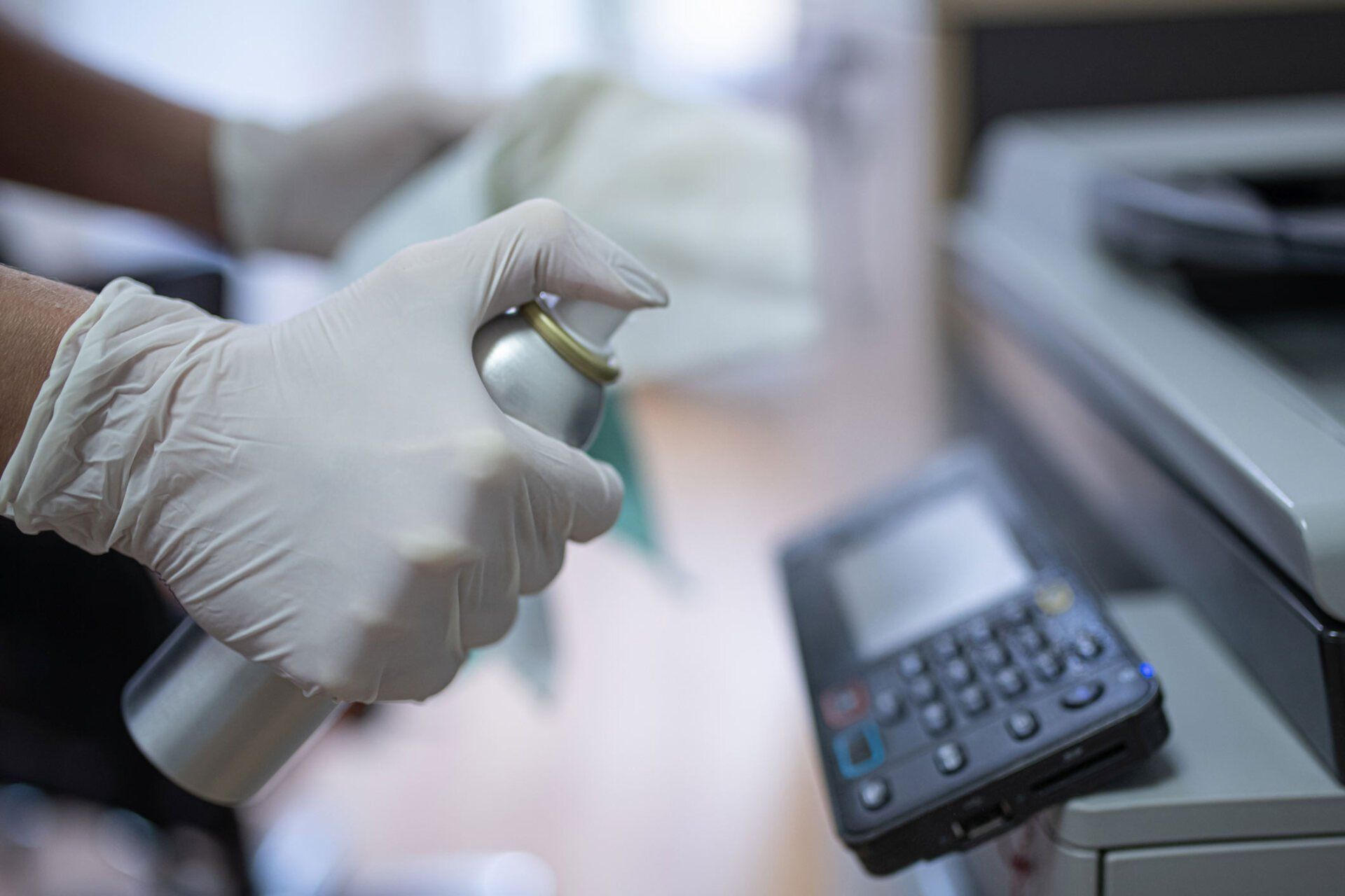 Person Disinfects a Printer