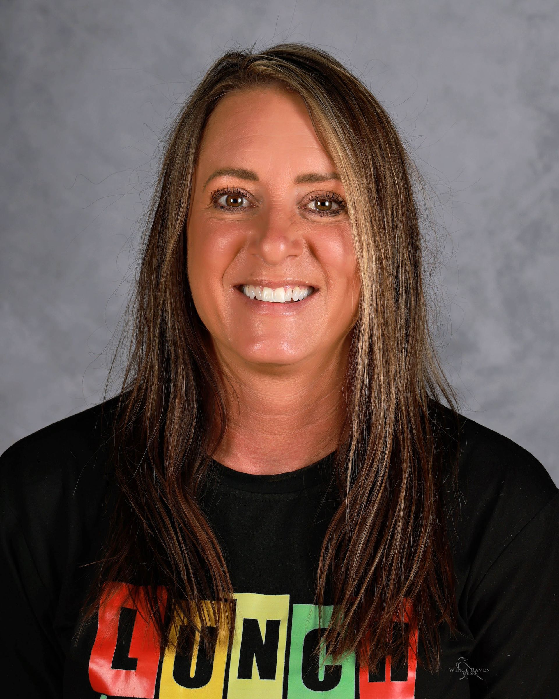 Woman with long hair wearing a black shirt with 