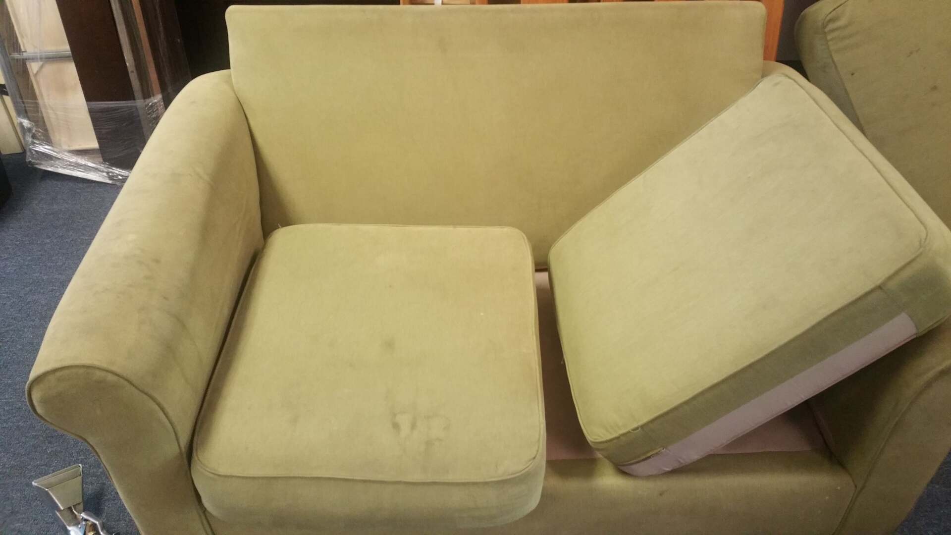 A chair with a cushion on the back of it