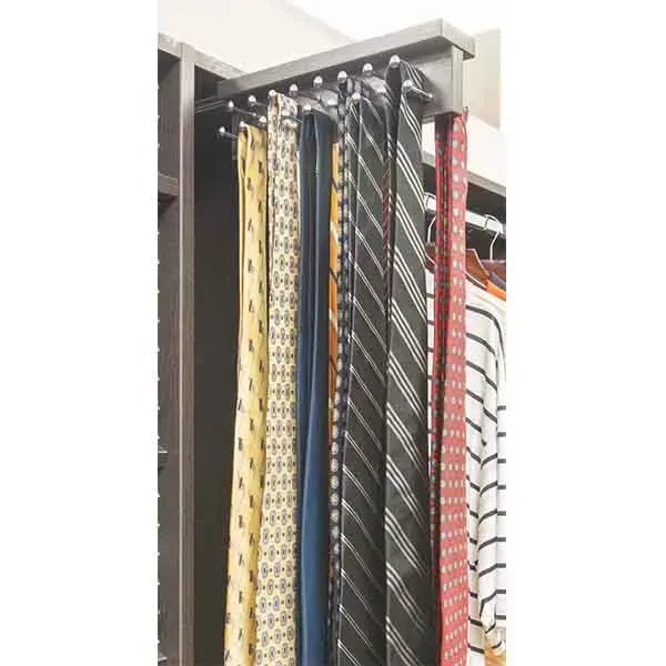 Hanging neckties in assorted patterns and colors displayed on a store rack.