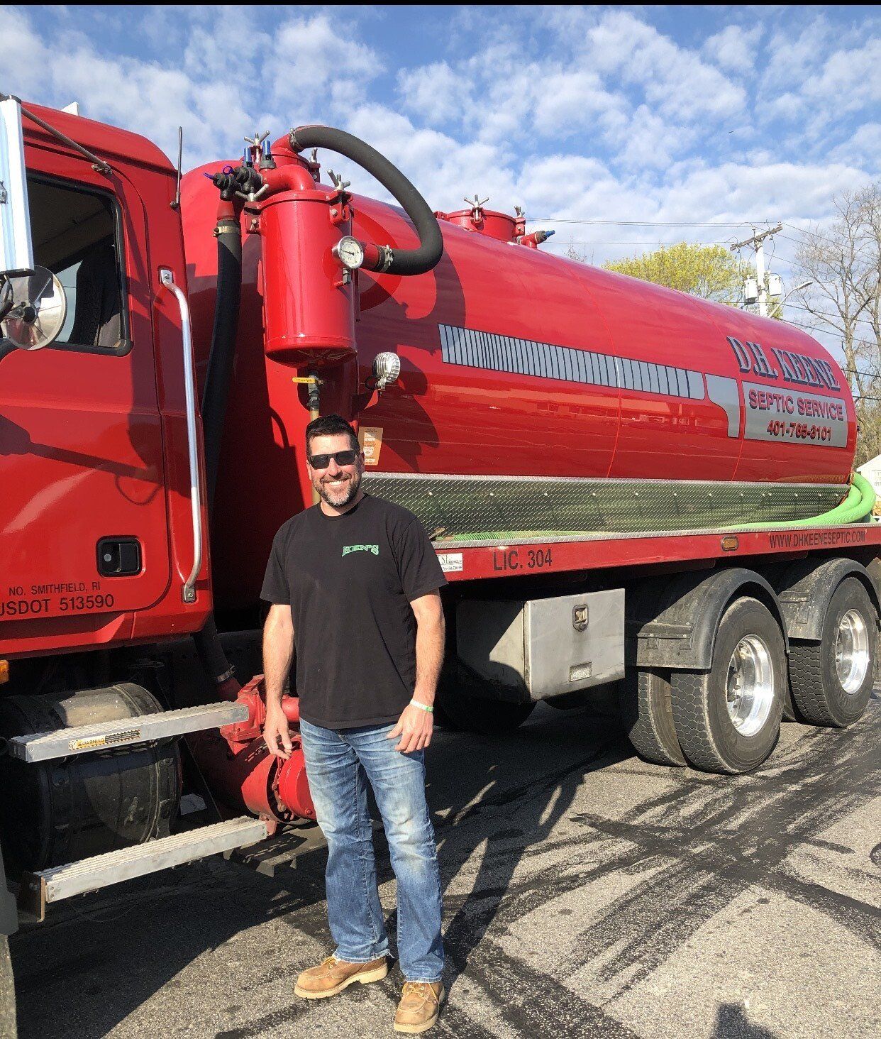 Worker Opening a Septic Tank — Blackstone, MA — D.H. Keene Septic Service