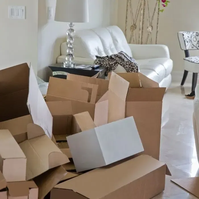 A pile of cardboard boxes in a living room