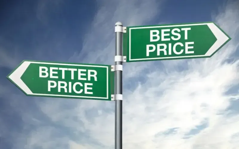 Two green street signs pointing in opposite directions saying best price and better price