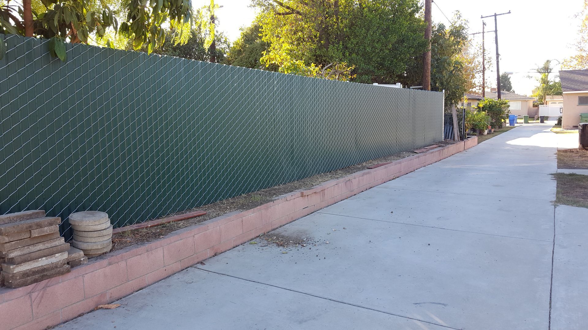 Chain-link fence with privacy inserts completed for a client