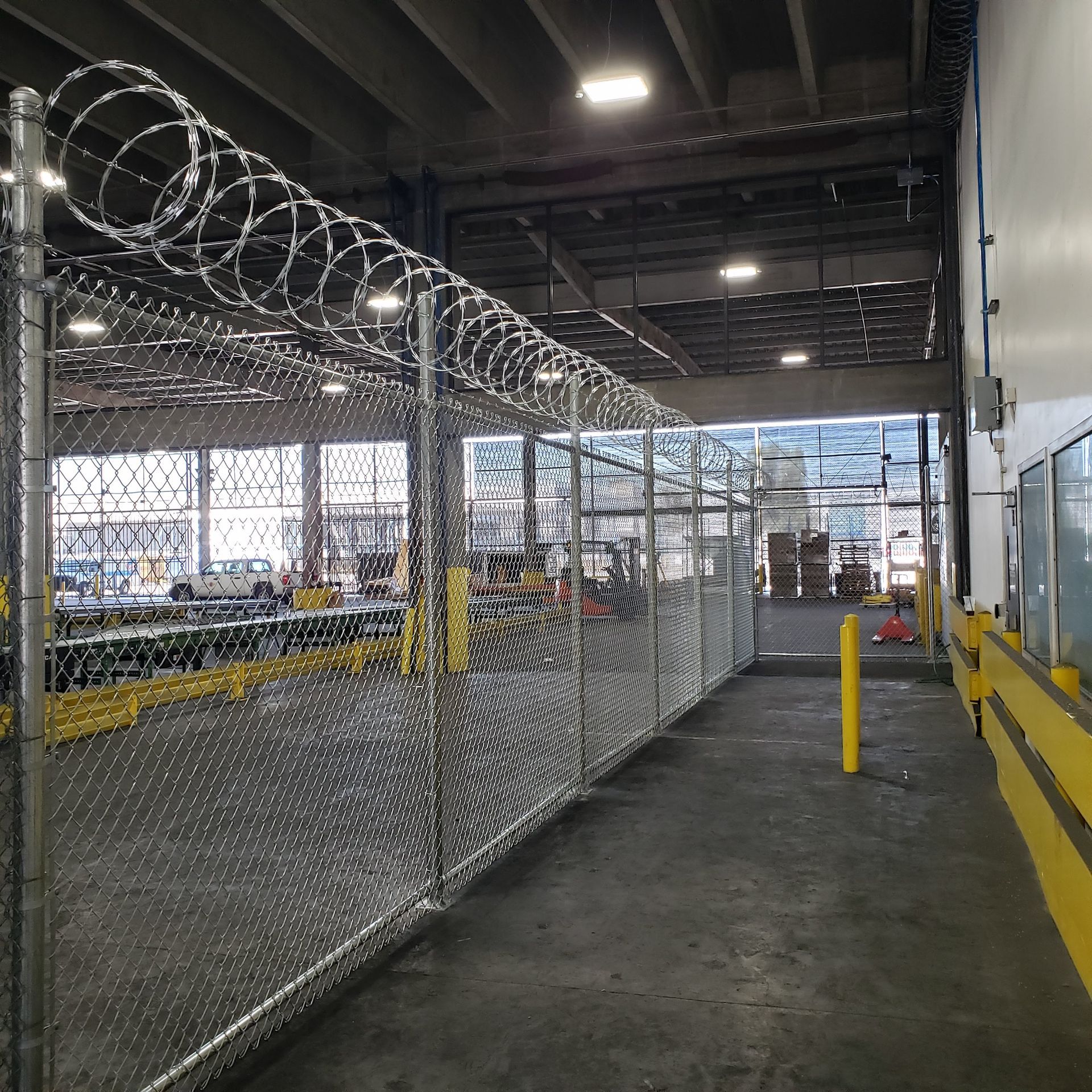 Chain-link fence perimeter installed around a commercial lot