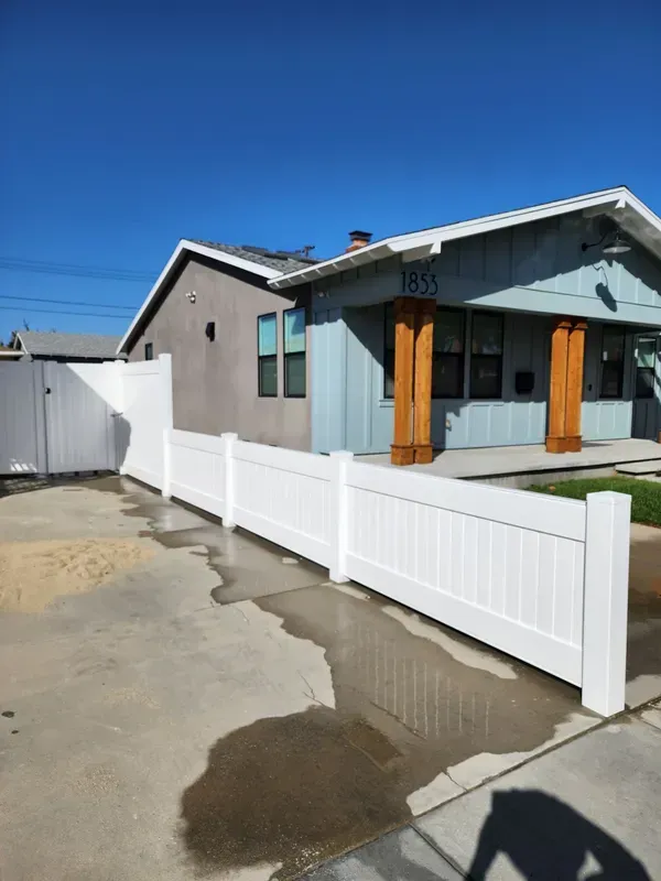 White vinyl fence surrounding a Southern California home