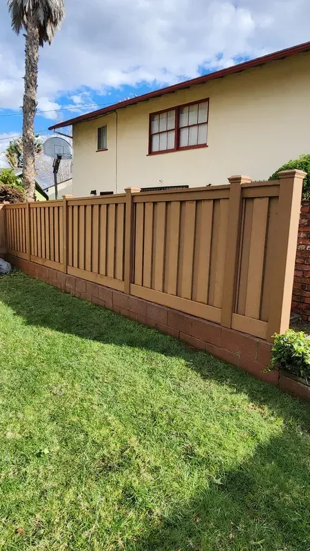 Brown Trex composite fence installed beside a Los Angeles property