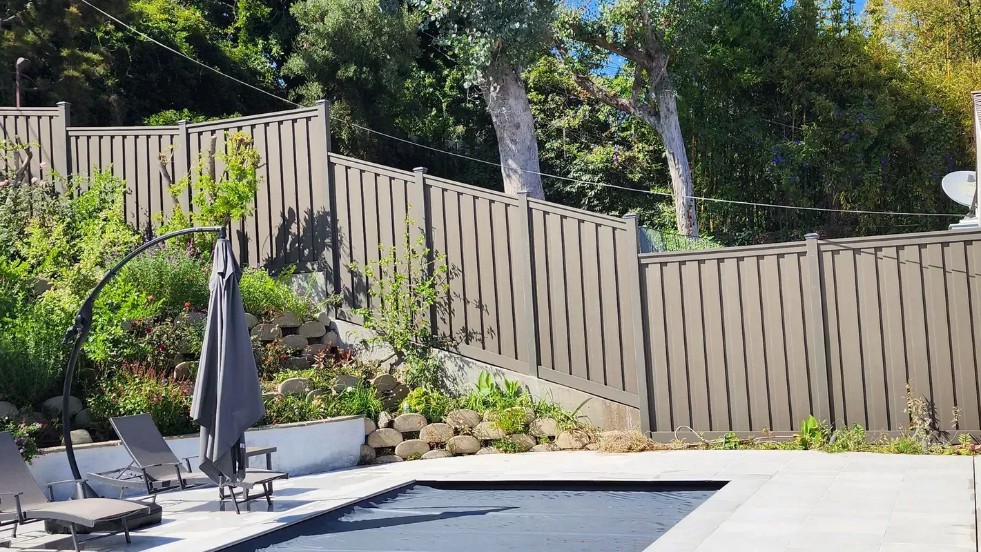 Trex composite fence enclosing a Los Angeles backyard pool area