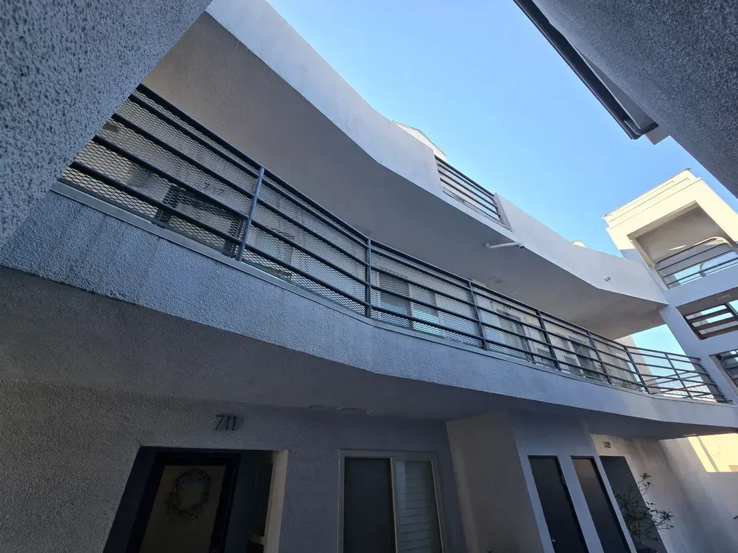 Custom iron balcony railings installed for a Southern California building