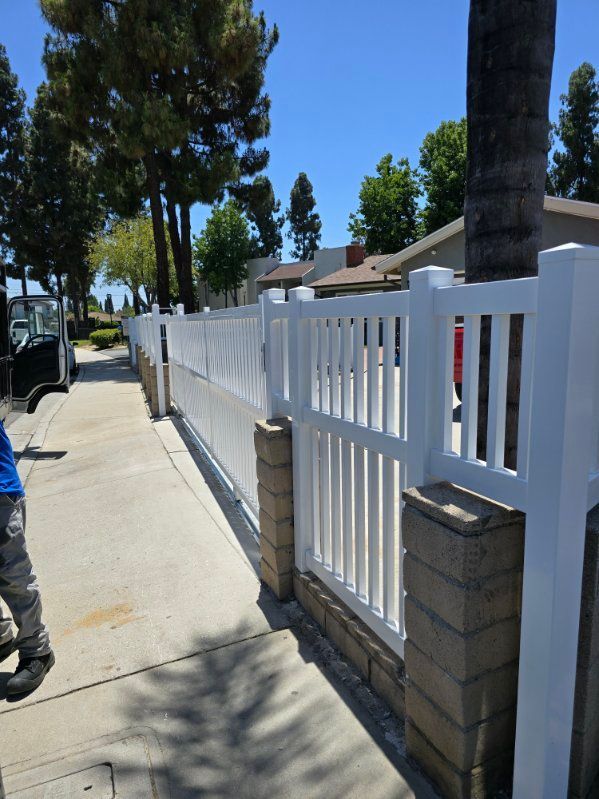White vinyl privacy fence installed for a residential property