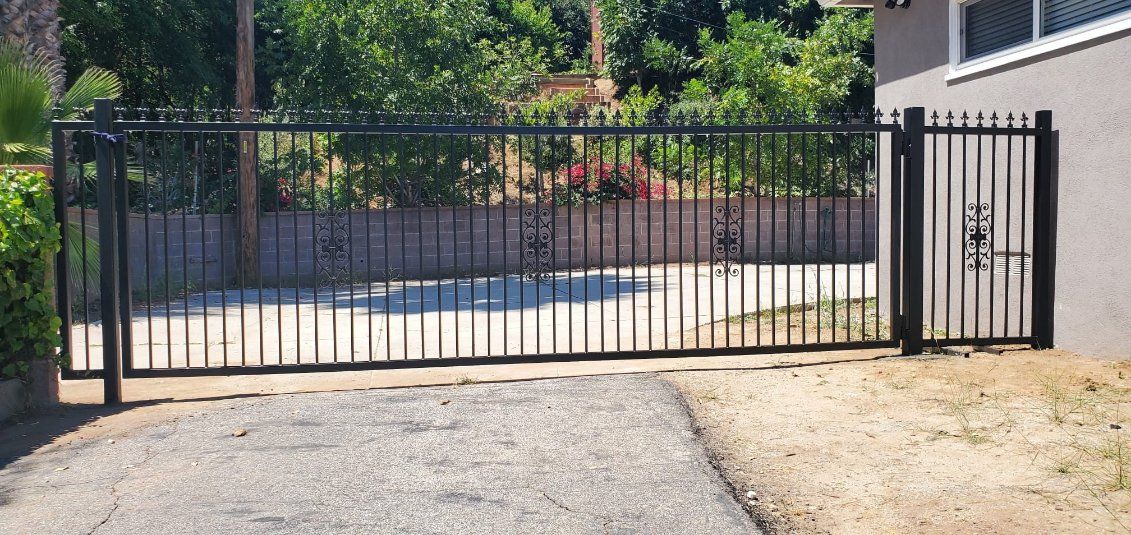 Iron gate and fence combination installed for a client