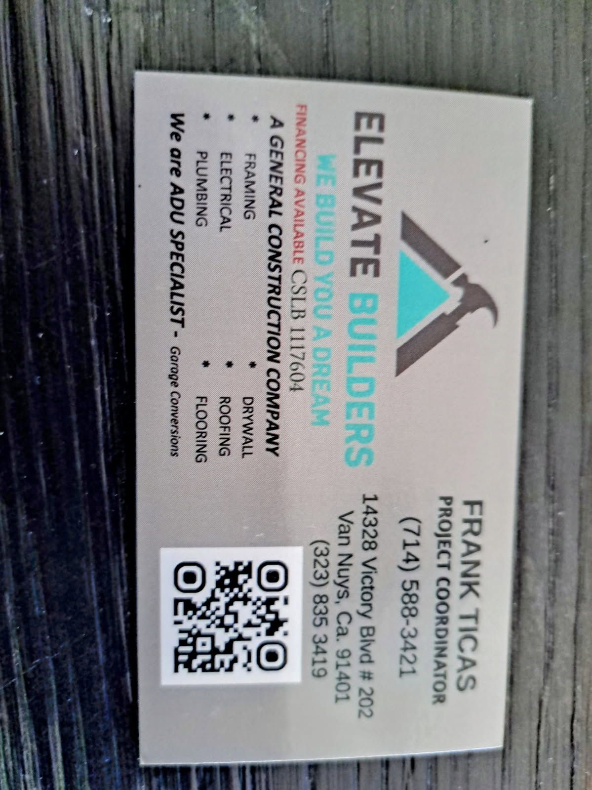 A business card that says elevate builders on it