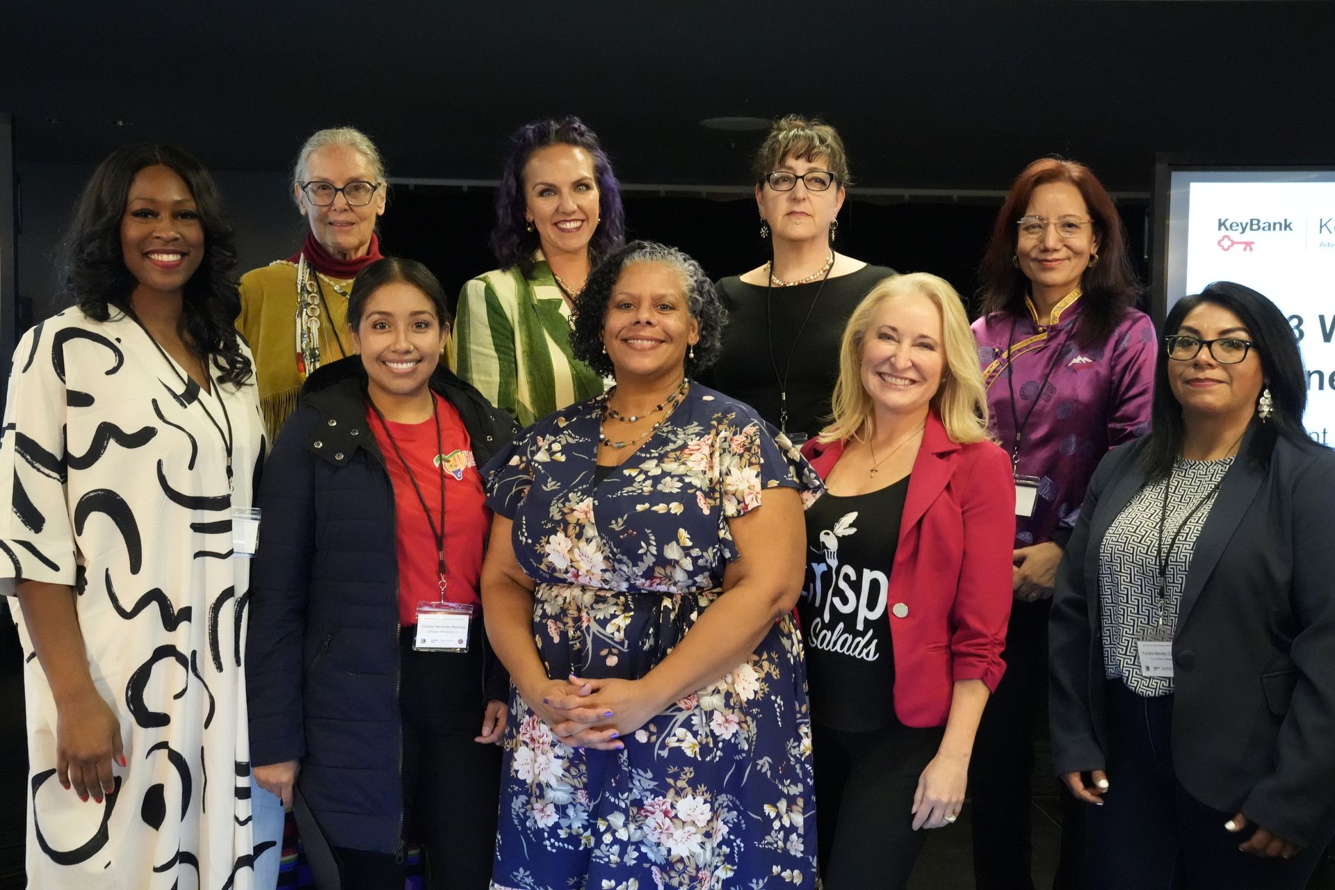 A group of women are posing for a picture together.