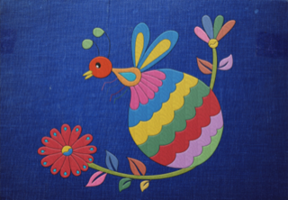A colorful bird is sitting on a branch with flowers