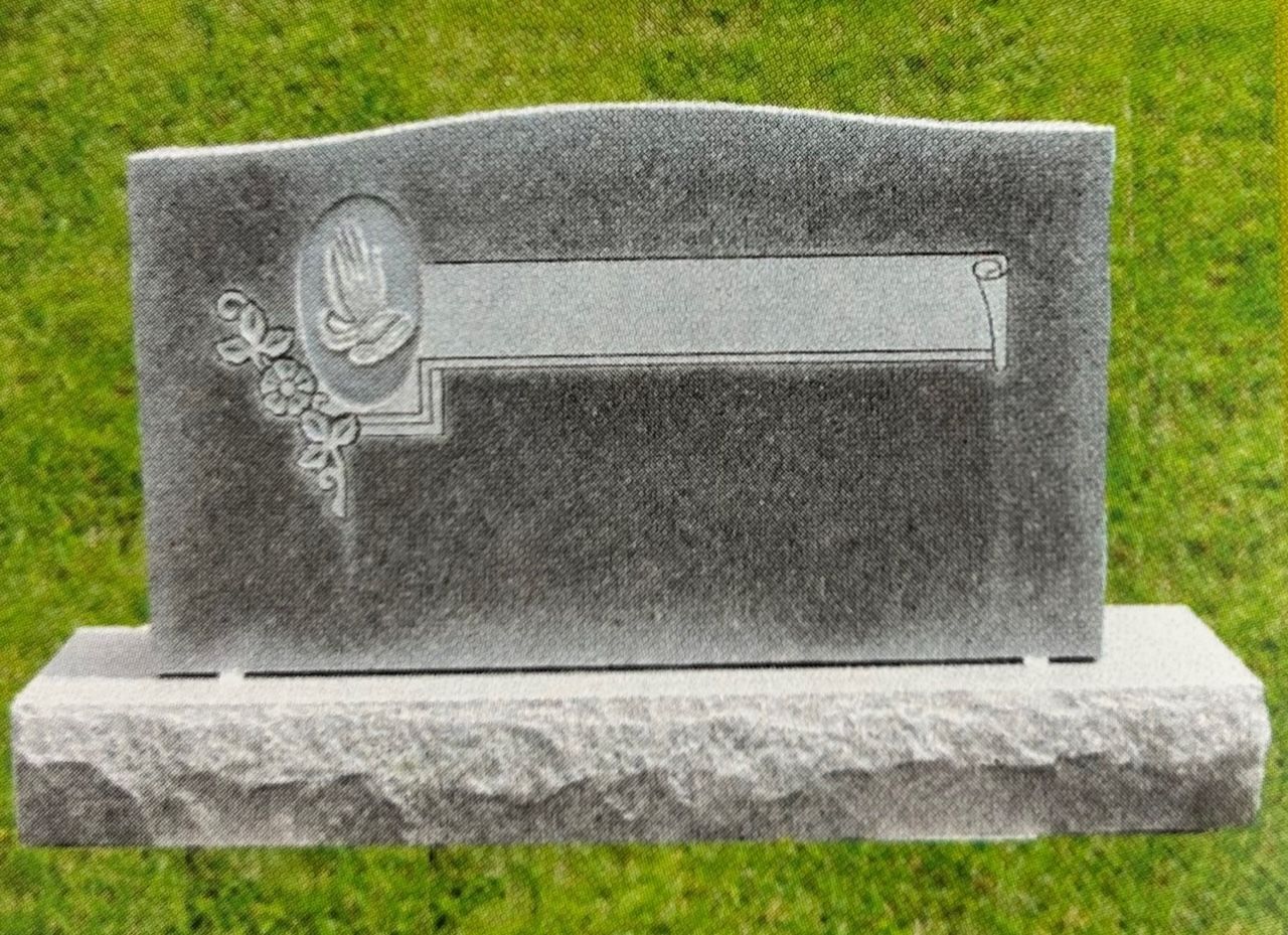 Gray granite headstone with praying hands and space for inscription.
